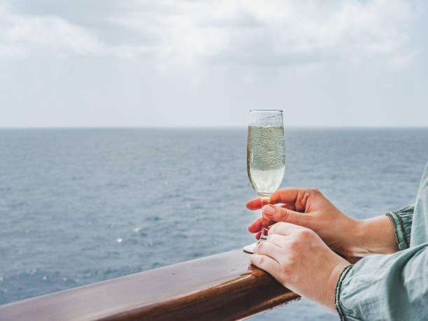 istock Woman holding a glass on the deck 1194319703