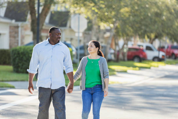 istock Happy interracial couple taking a walk 1194319866
