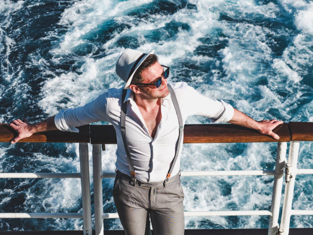 istock Smiling man on the empty deck of a liner 1194320810