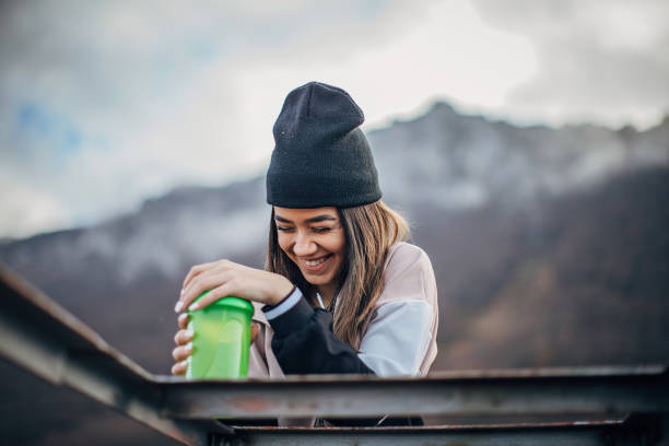 istock Cheerful young woman in nature 1194321216