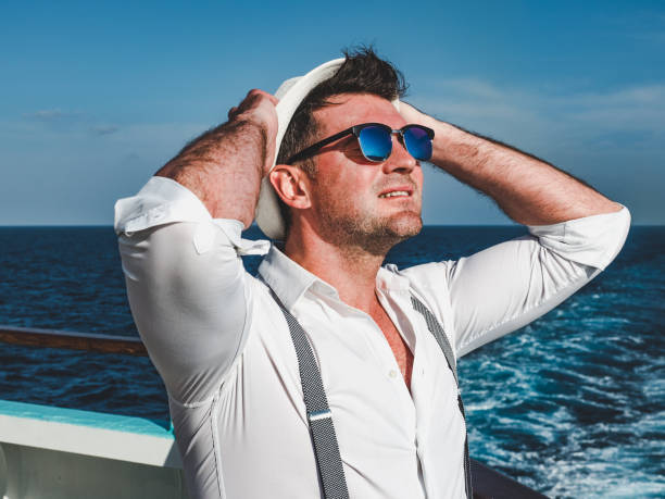 istock Smiling man on the empty deck of a liner 1194321263