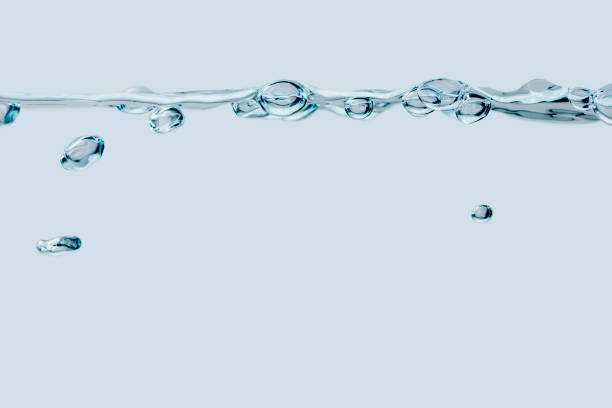 istock Row of air bubbles on light blue 1194322264