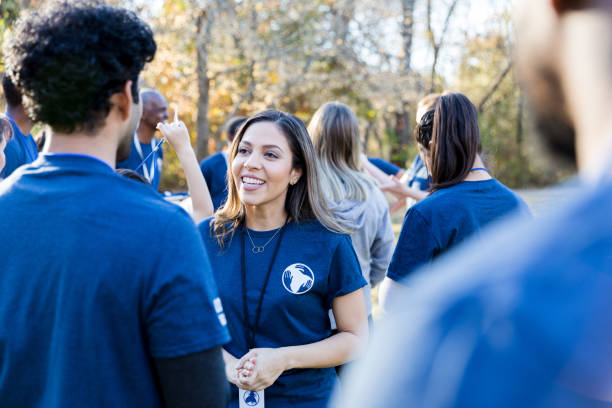 istock Diverse friends volunteer during community event 1194322419
