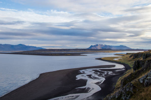 istock rough wild landscape on Iceland black beach 1194323661