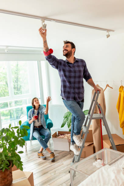 istock Couple arranging new apartment 1194324258