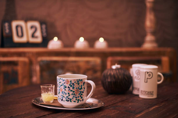 istock Hot tea with lemon juice on wooden table in rustic wooden interior 1194324976