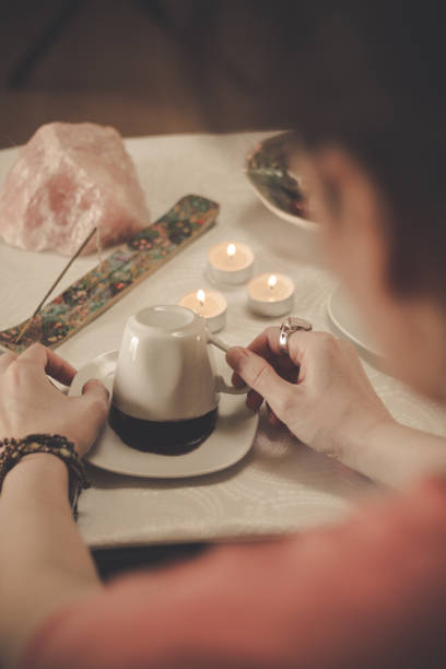 istock Fortune teller with a cup of coffee 1194325010