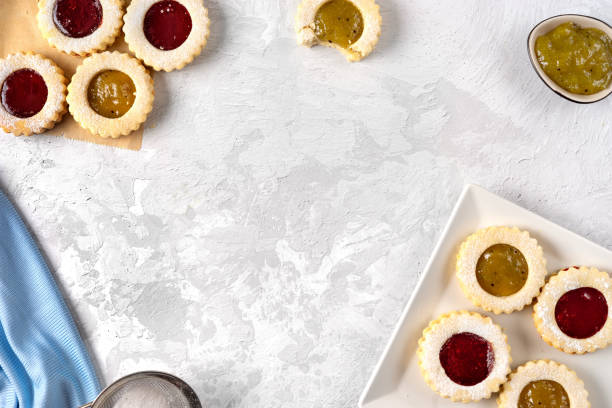istock Top view of colorful linzer cookies on light background 1194326464