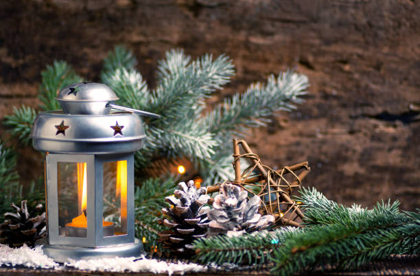Festive lantern and Christmas decorations home arrangement with rustic background