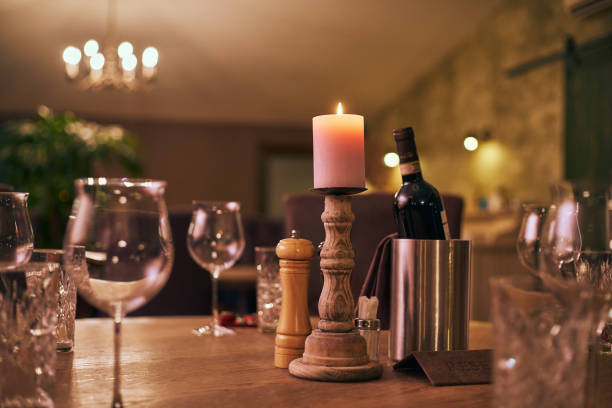istock Candle in the candle holder on a laid wooden rustic table 1194326538