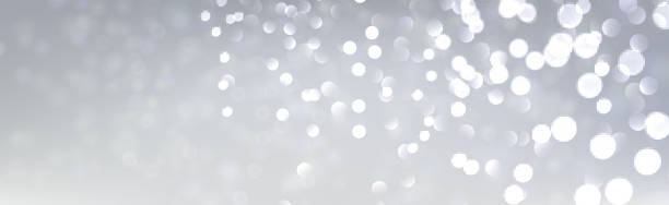 istock Christmas and New Year horizontal card with defocused ligths on grey. 1194327449