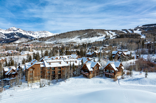 A portion of Telluride Mountain Village shows the kind of lodging available on a sunny day in Winter. Telluride Mountain Village, Colorado, USA, December 5, 2019