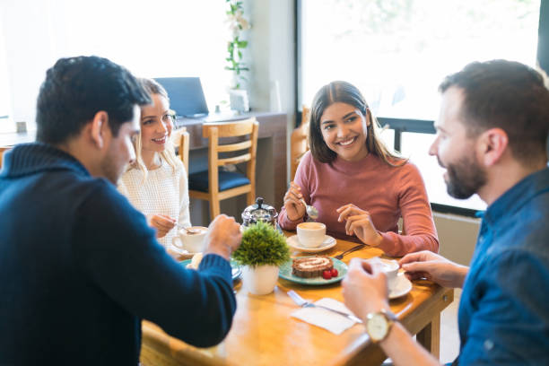 istock Friends Spending Leisure Time In Cafe 1194328699