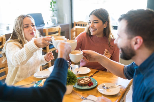 istock Happy Friends Celebrating At Cafe 1194328962