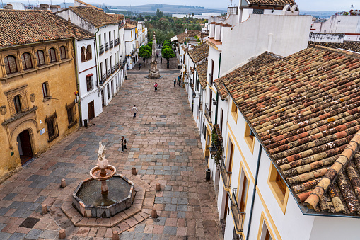 Cordoba, Spain - October 31, 2019: Square of Colt, Plaza del Potro in Cordoba, Spain. Plaza del Potro is named after fountain in plaza, which features a small, prancing horse balanced atop a vase.