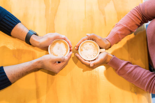 istock Lovers With Coffee Cups At Restaurant 1194329150
