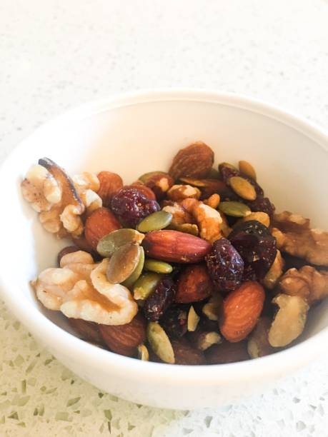 istock Bowl of healthy nuts and berries 1194330379