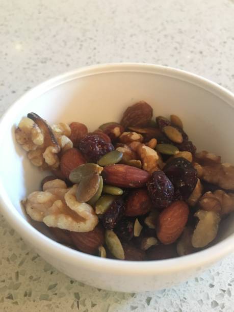 istock Bowl of healthy nuts and berries 1194330388