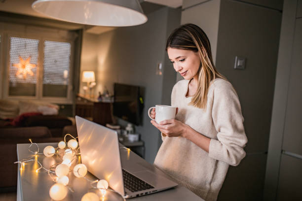 istock Young woman with laptop 1194330579