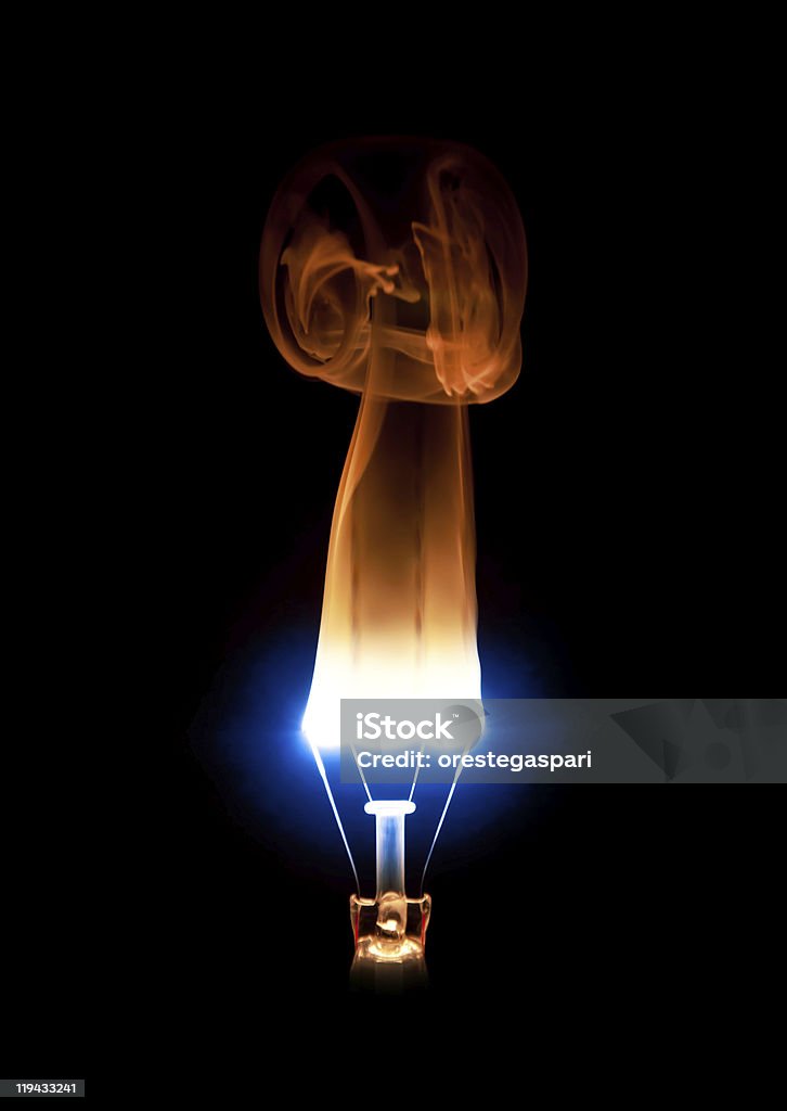 Light bulb burning out  Black Background Stock Photo