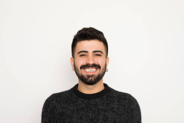 istock Young man portrait lookling at camera. Isolated on white background. 1194332998