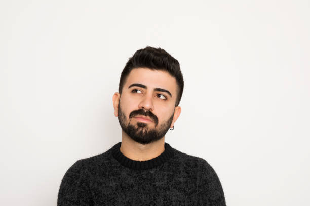 istock Young man portrait lookling at camera. Isolated on white background. 1194333033