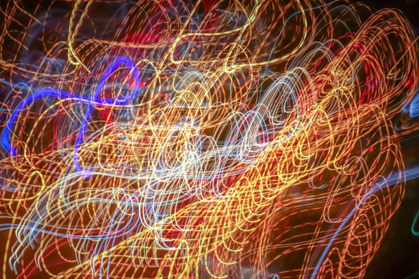 istock Abstract light traces background. Lights trails dynamic backdrop. Night exposure motion lines texture. 1194334025