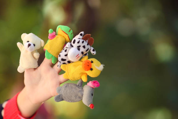 istock Animal dolls child playing on fingers. 1194334977