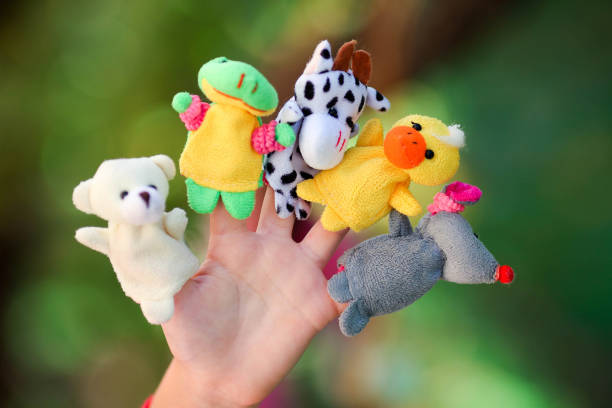 istock Animal dolls child playing on fingers. 1194334997
