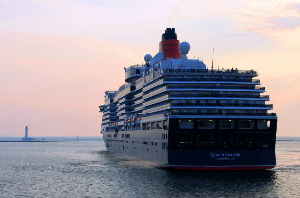 Cruise liner Queen Victoria of Cunard Line shipping company is mooring at passenger terminal in port of Odessa. September 04, 2011