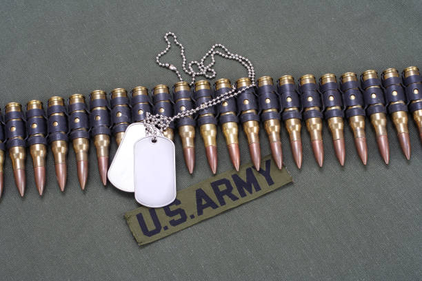 istock ammunition belt and dog tags on US ARMY uniform 1194336171
