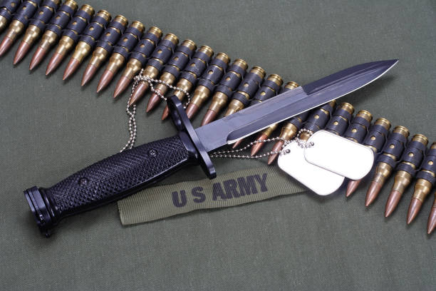 istock bayonet and ammunition belt on US ARMY uniform 1194336210