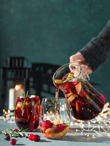 istock Winter sangria pouring in glasses, christmas table 1194336357
