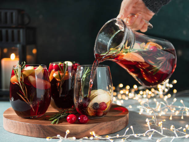istock Winter sangria pouring in glasses, christmas table 1194336547