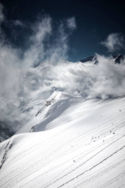 istock swiss alps mountain peak cloudscape, switzerland 1194337583