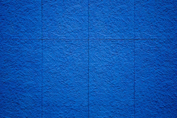 Rough textured blue wall composed of stone slabs