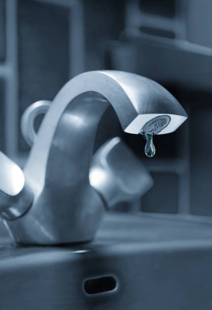istock Dripping water faucet 1194339315