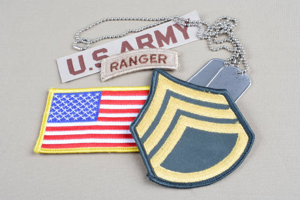 istock US ARMY Staff Sergeant rank patch, ranger tab, flag patch and dog tag 1194341824