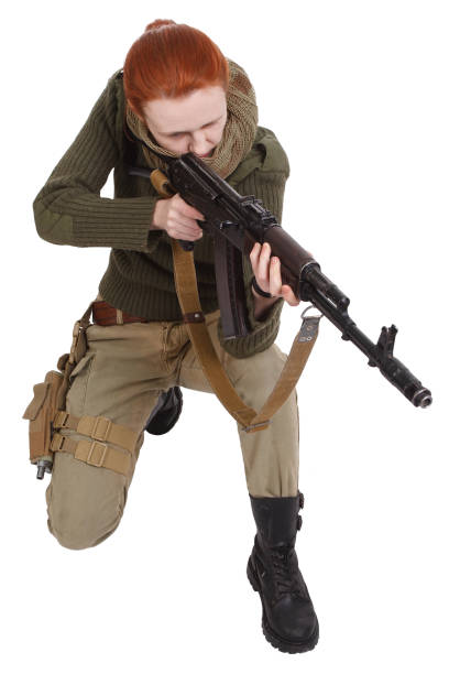 istock girl mercenary with ak-47 rifle 1194342369