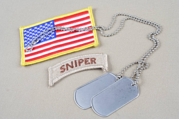 istock US ARMY sniper tab with dog tag  and flag patch 1194342396