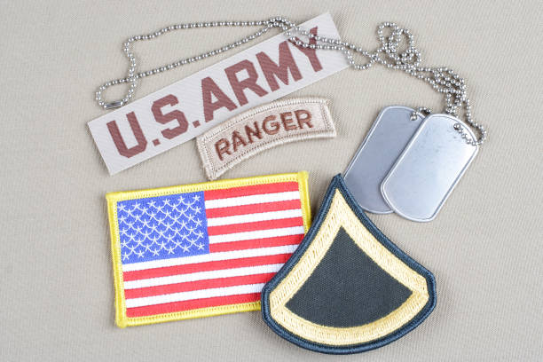 istock US ARMY Private First Class rank patch, ranger tab, flag patch and dog tag 1194342547