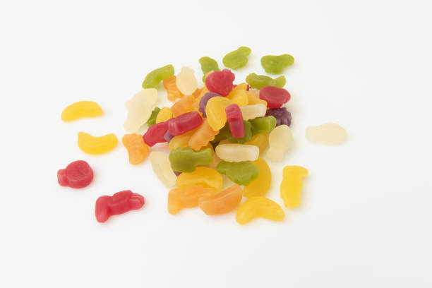 Tropical fruit Gummies Tropical fruit Gummies on white background pick and mix stock pictures, royalty-free photos & images
