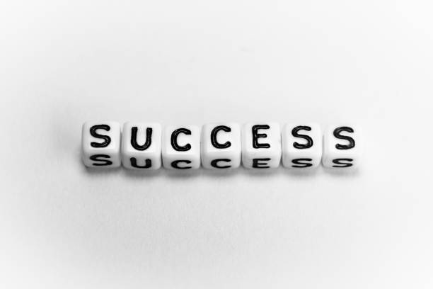 White cubes with word SUCCESS on white background