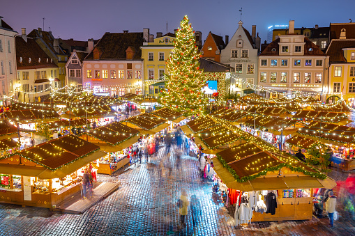 This pic shows Christmas market at town hall square in the Old Town of Tallinn, Estonia. The pic is taken at night time and in december 2019.