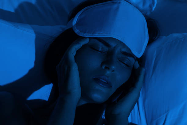 istock Young woman with a headache and insomnia 1194352328