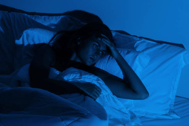 istock Young woman with a headache and insomnia 1194352349