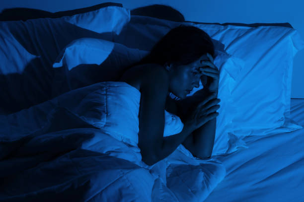 istock Young woman with a headache and insomnia 1194352387