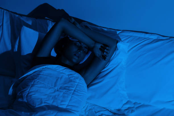 istock Young woman with a headache and insomnia 1194352394