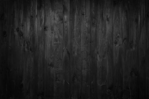 istock Black stressed wooden boards background texture 1194352586