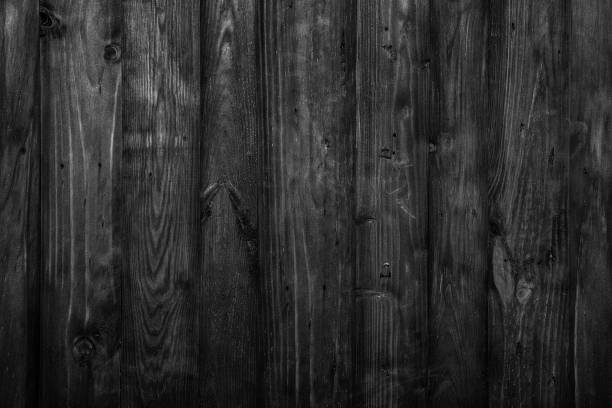 istock Black stressed wooden boards background texture 1194352590